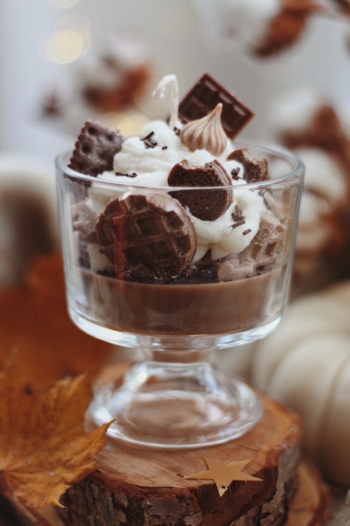 services-01 Indulge in a delicious chocolate dessert topped with whipped cream and waffle pieces.