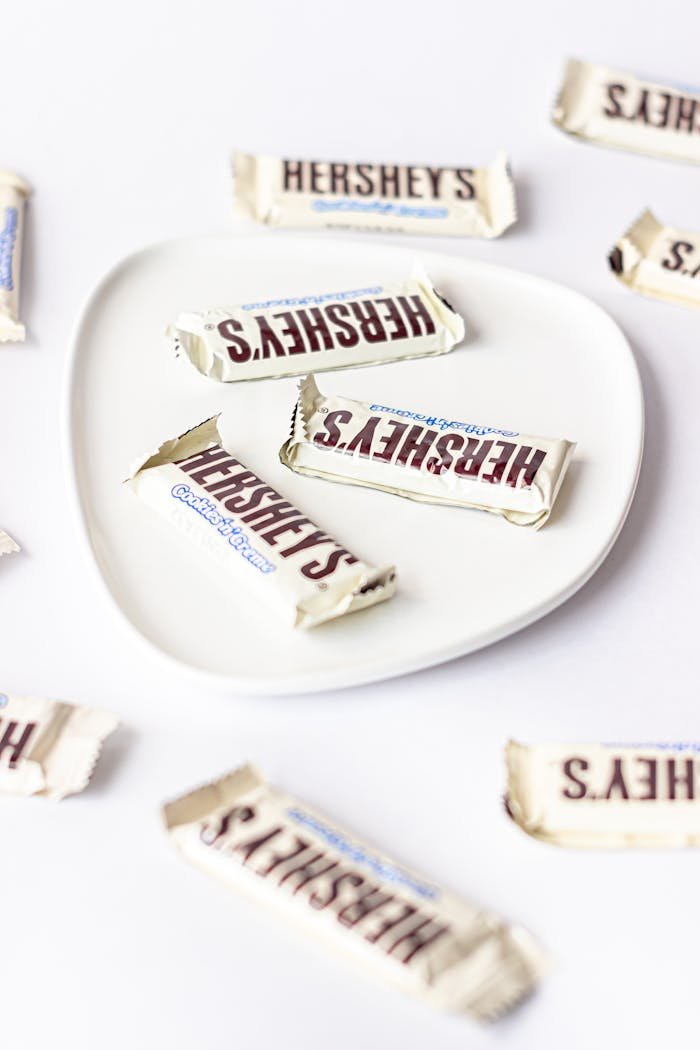 services-02 Assorted Hershey's chocolate minis elegantly arranged on a white plate, perfect for sweets lovers.
